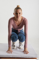  Kate Jones  1 blue jeans casual dressed kneeling pink long sleeve t shirt white sneakers whole body 0001.jpg